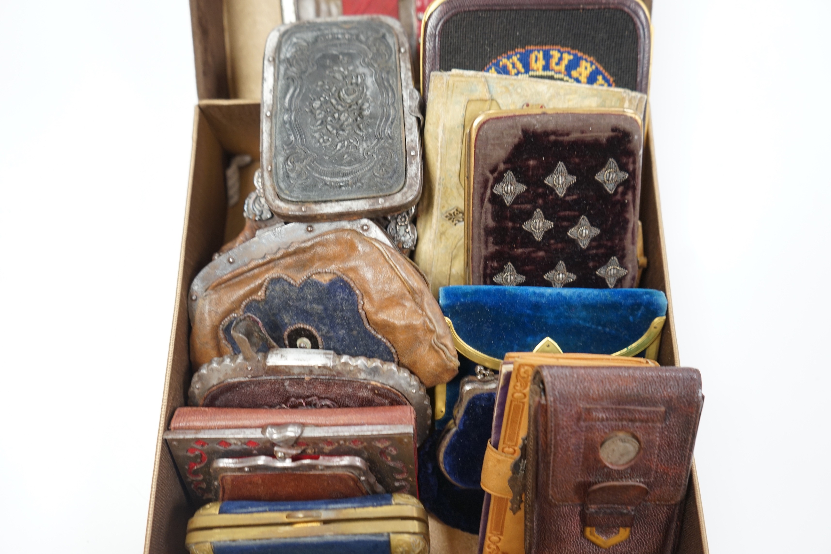 A collection of early 19th century and later embroidered, petite point, leather cut steel and velvet purses card cases etc